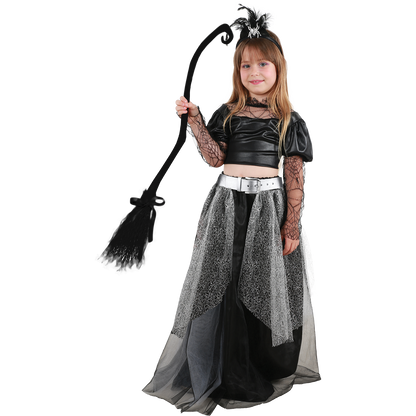 Model wearing Lola Stars girls' witch costume: black web-sleeve top, long black and silver skirt and feather headband