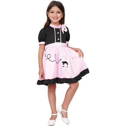 Model wearing Lola Stars teen girls' 50s costume: black and pink poodle dress with ruffled hem and pink neck scarf